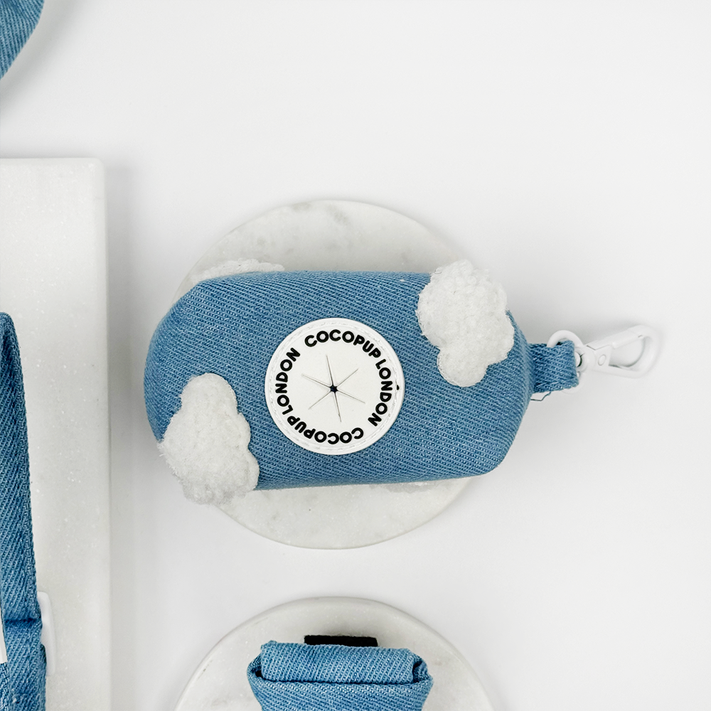 Blue Denim Poop Bag Holder with white fluffy clouds. 