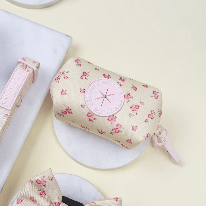 Floral Dog Poop Bag Holder with yellow background and pink flowers.