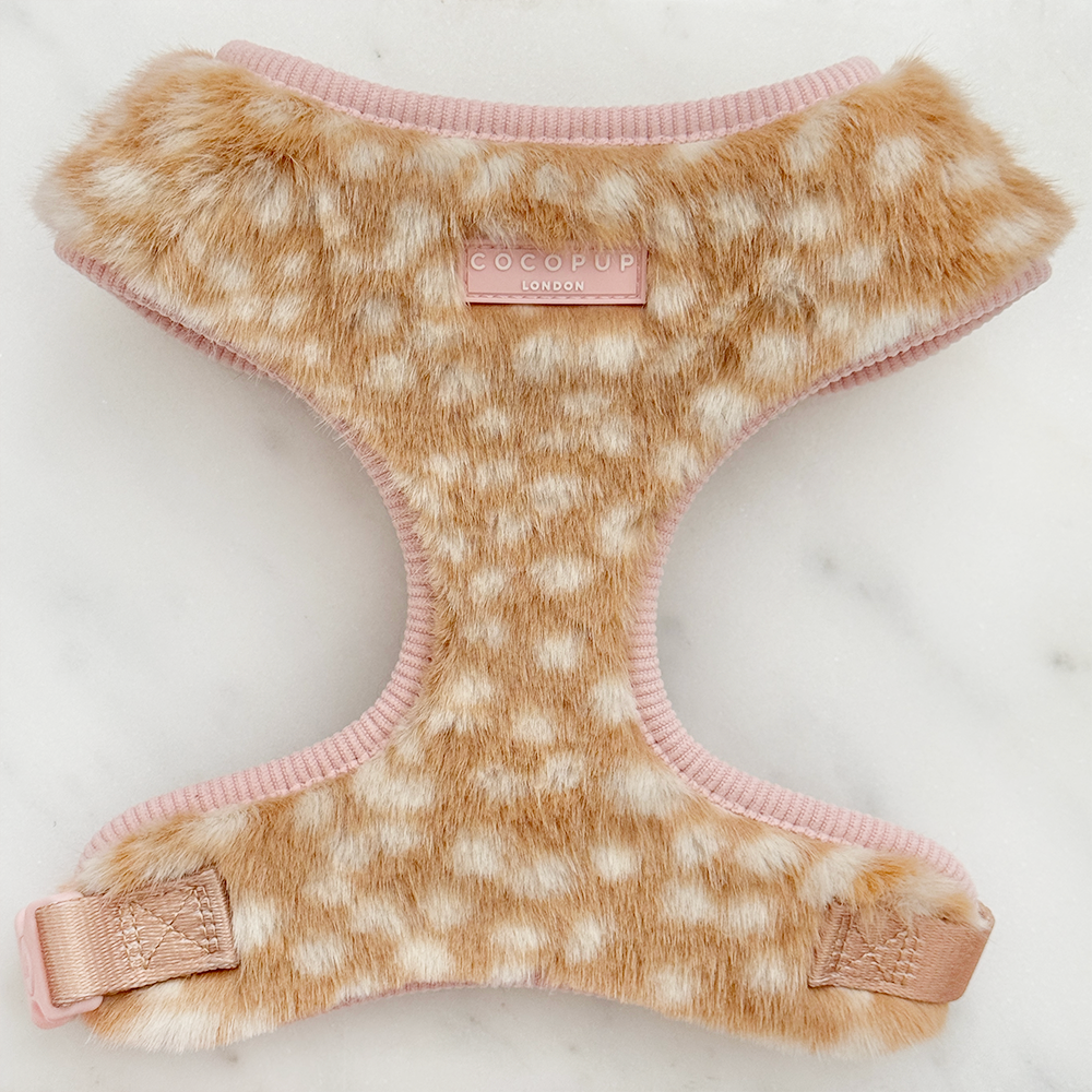Faux fur dog harness in a beige and cream fawn pattern with pink ribbed trim and matching pink straps.