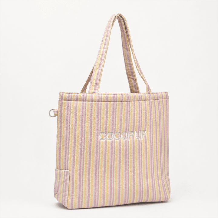 Pink, yellow and orange striped Tote Bag with poop bag dispenser and D-Ring on side.